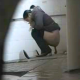 A lone, Chinese girl is recorded taking a shit in a public restroom floor toilet. She is soon joined by other women, pissing and shitting into the toilets around her in full view. Over 8.5 minutes.